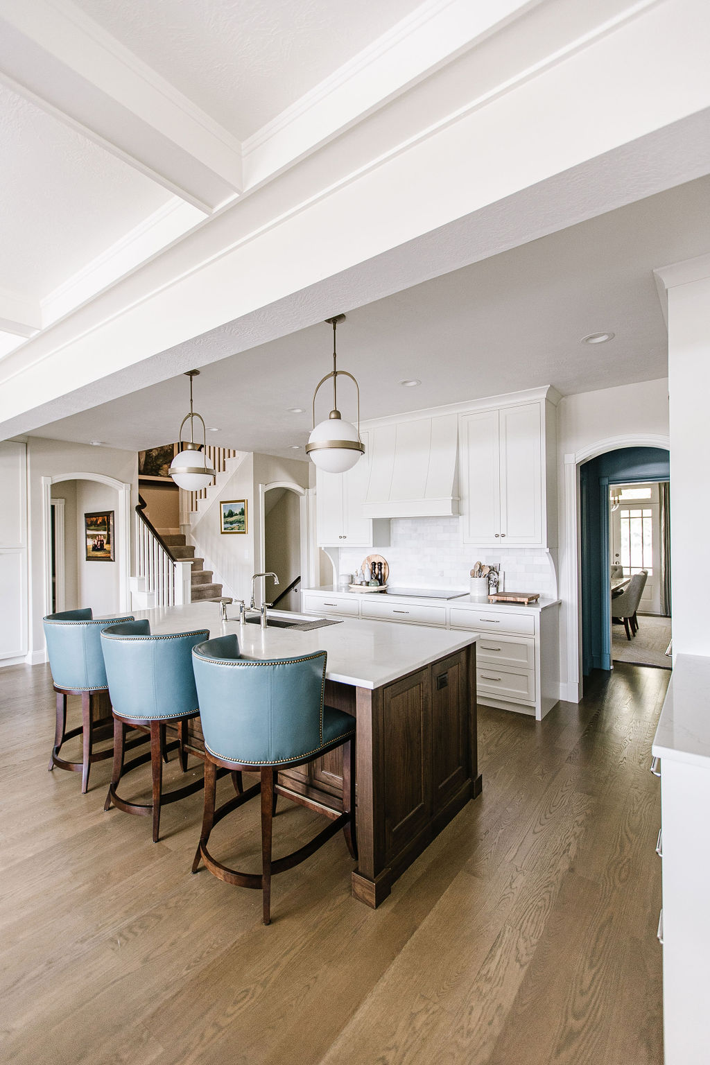 Open concept kitchen with blue barstools